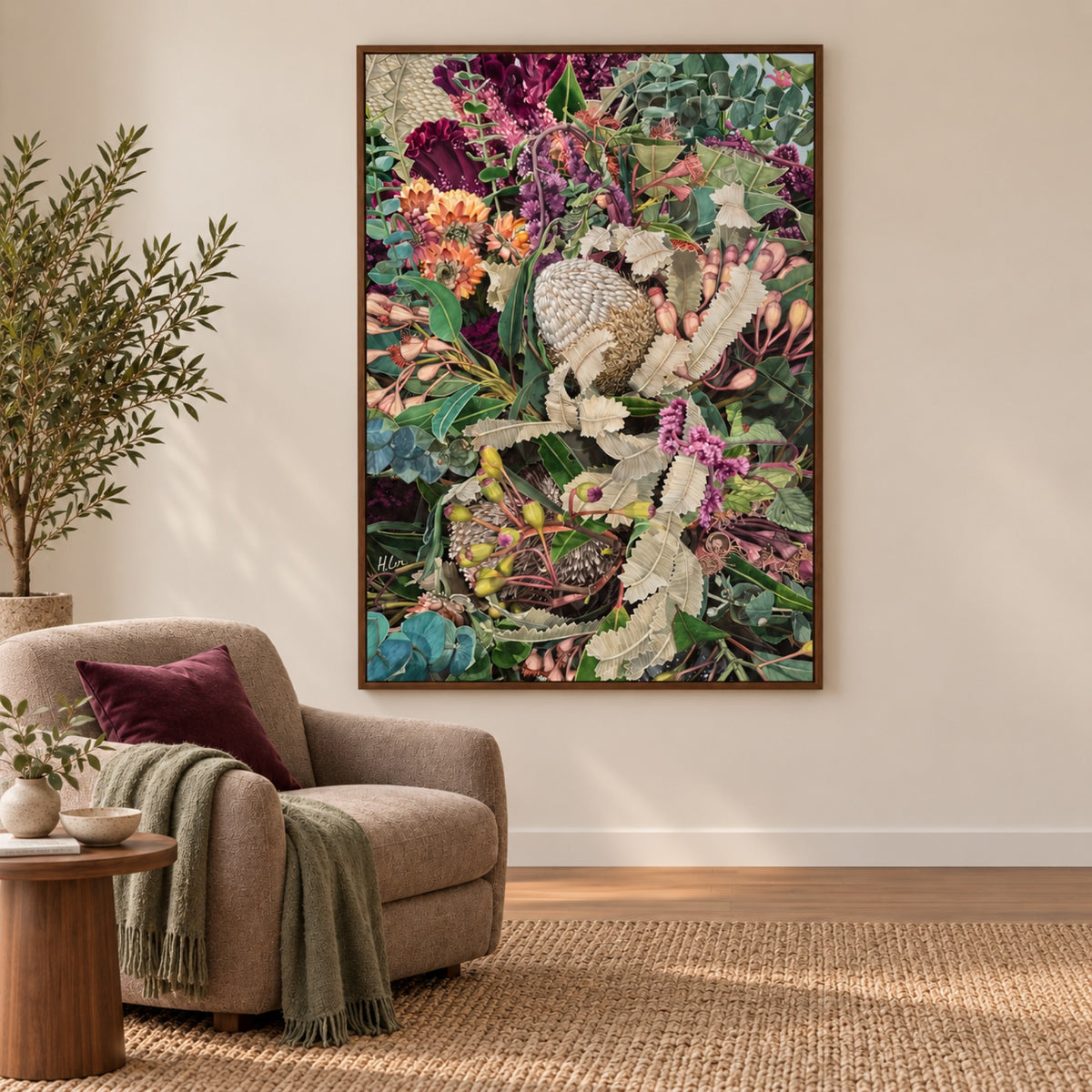 A Thousand Ways to Love displayed in a walnut frame in a taupe reading corner with plum accents.