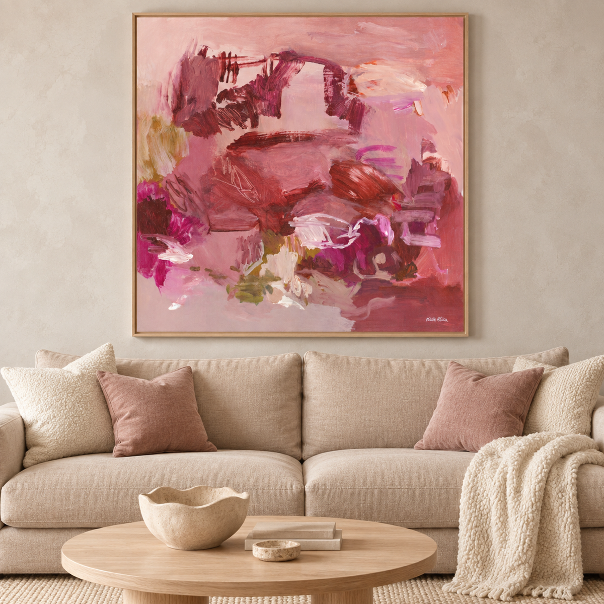 Auburn Echoes wall art above a light neutral sofa in a warm contemporary living room