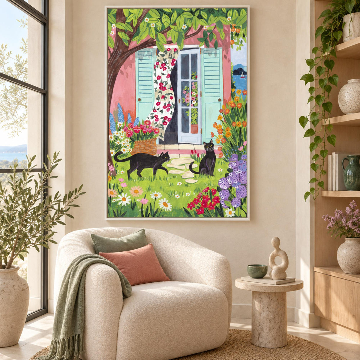 Garden Cats by the Sea in a white floating frame above a contemporary single seat sofa