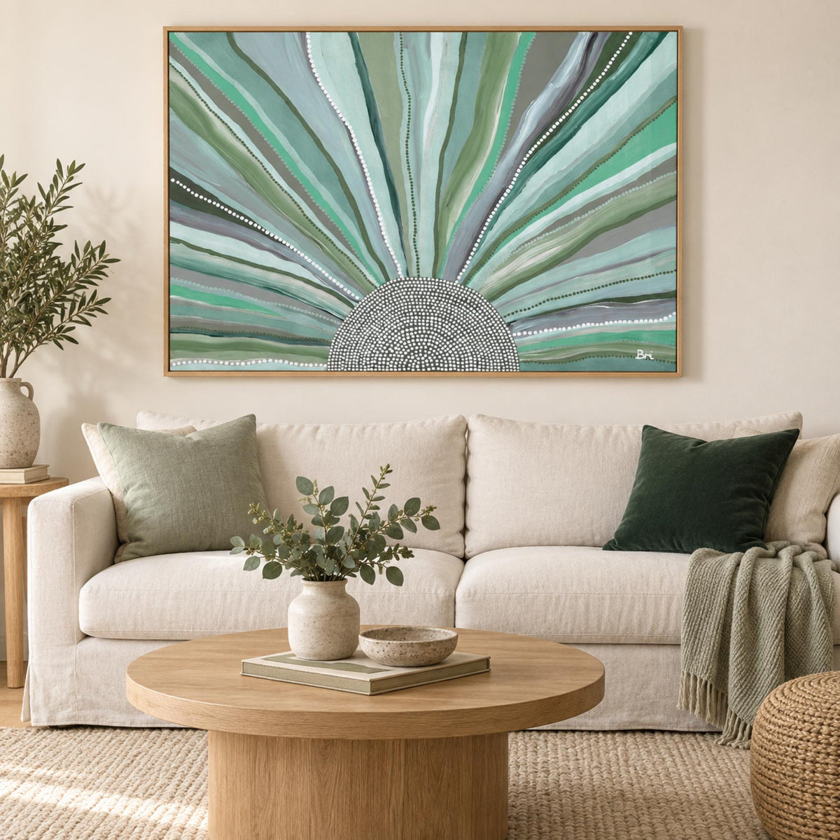 Rising Sun, Green Tones wall art styled above a cream sofa