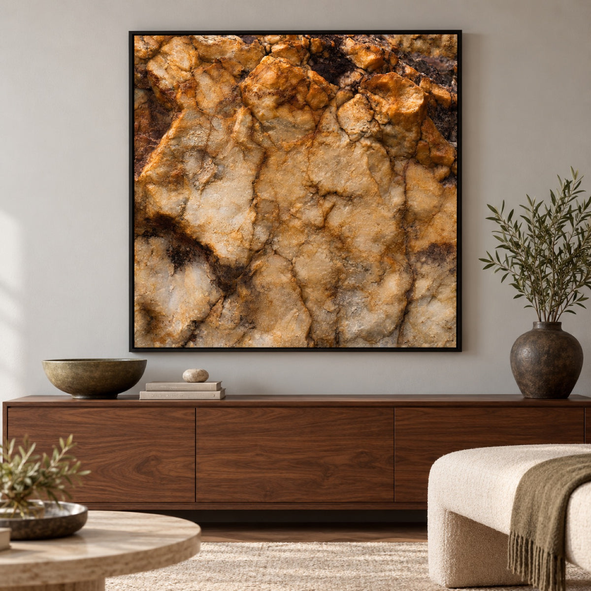 Study 24 Time Resurfaced Study rock-texture artwork in a black frame above walnut furniture with olive accents.