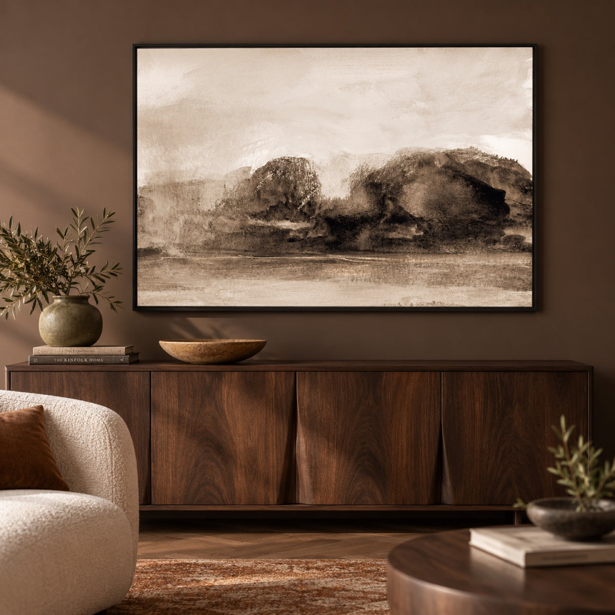 Woodland Breeze by Dan Hobday in a black frame above a walnut buffet in a rich brown living room.