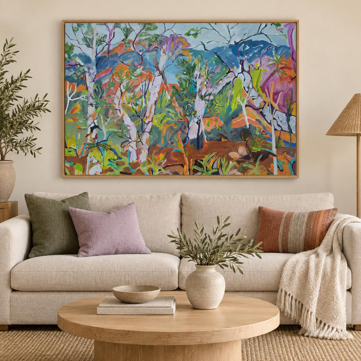 Arakwal wall art centred above a light neutral sofa in a contemporary Australian living room