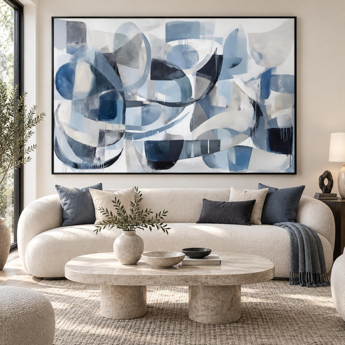 Blue motion in a black floating frame above a contemporary living room sofa