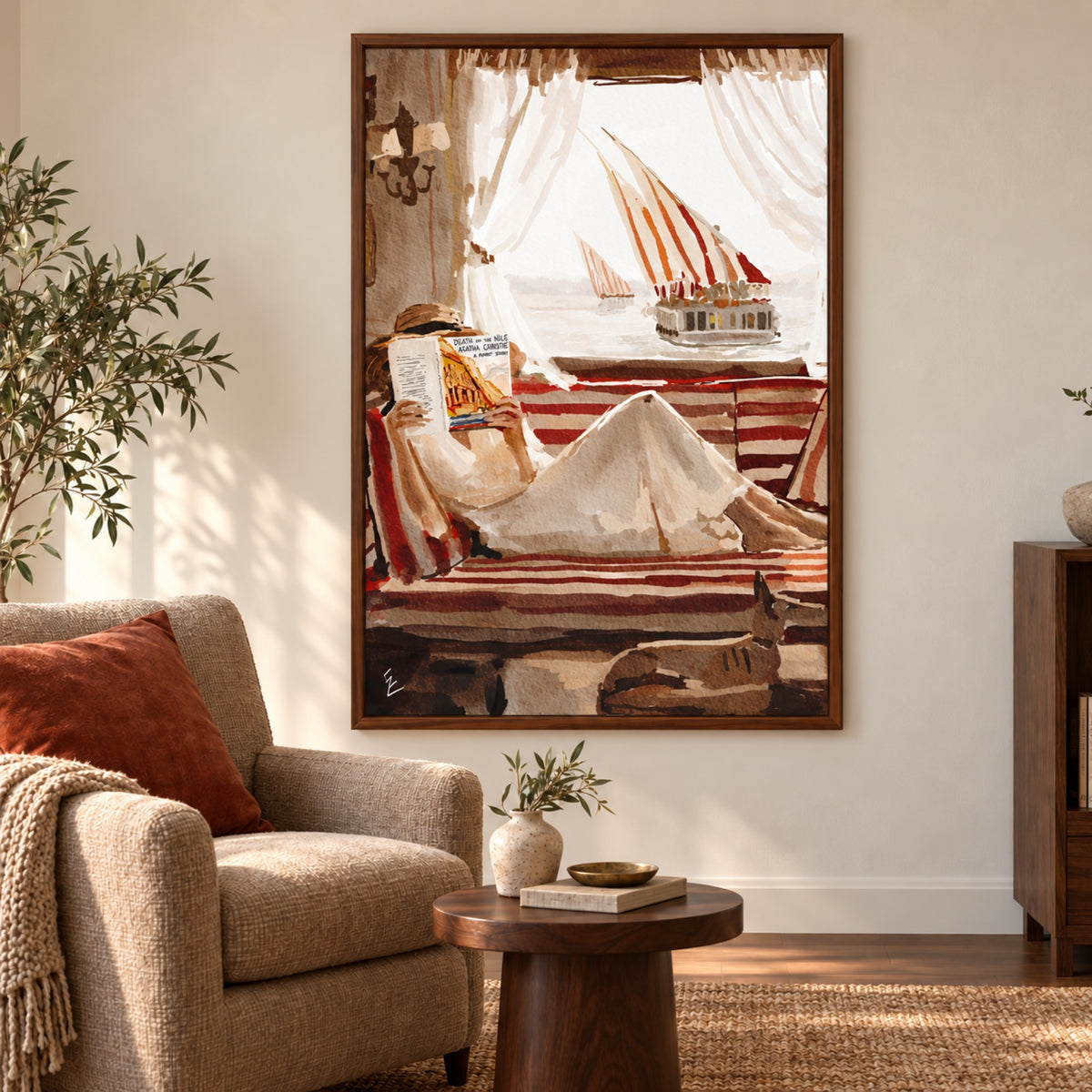 Death On Nill displayed in a walnut frame in a warm reading corner with rust textiles.