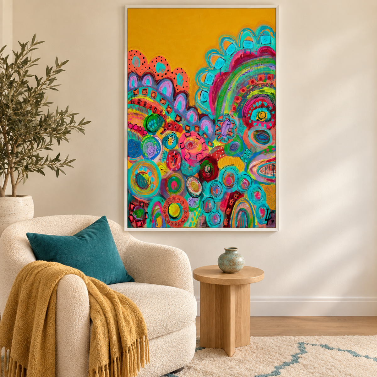 Electric Dreams by Lindy Farley in a white frame above a cream chair styled with teal and gold textiles.