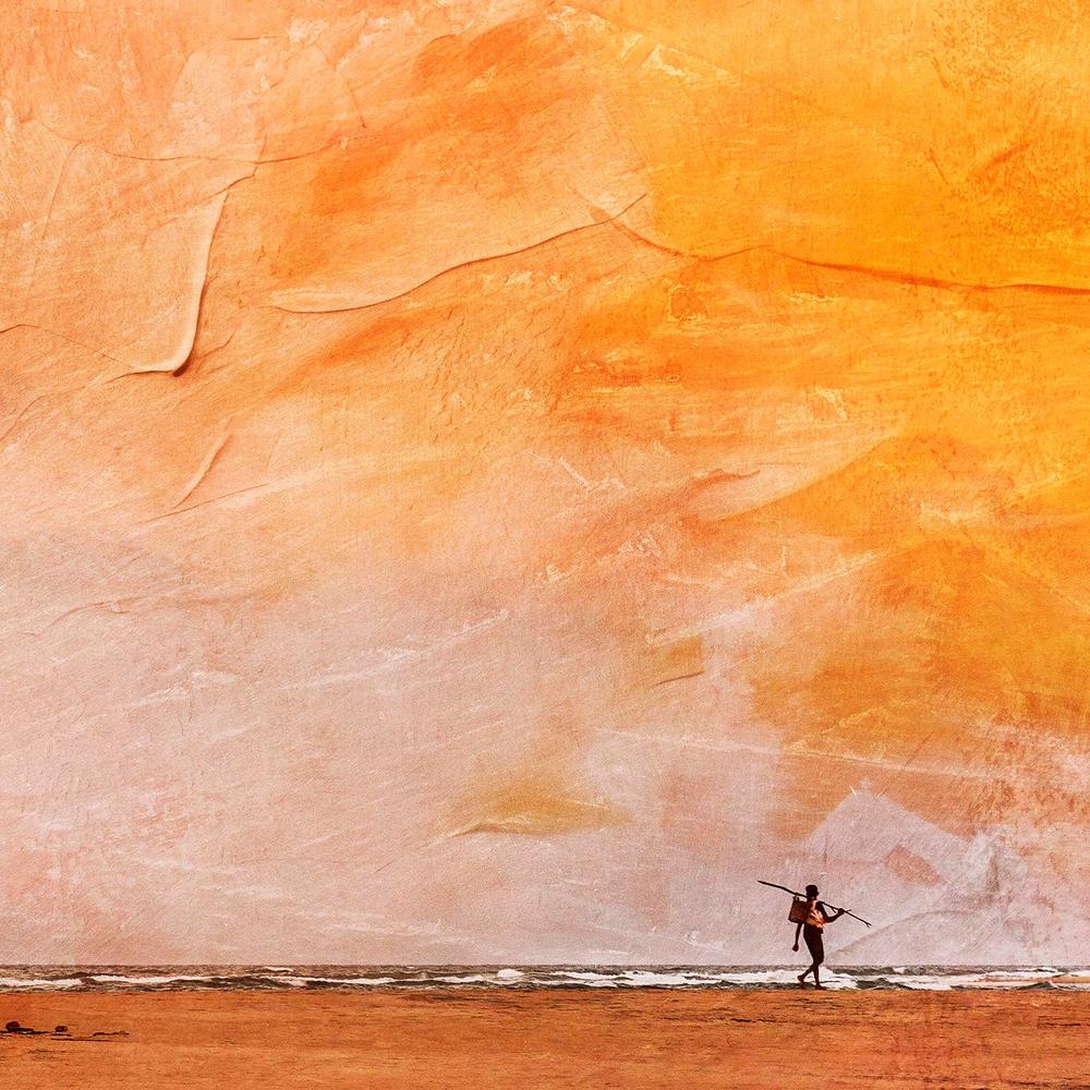 Fisherman Walking Home against a Painted Sunset Sky (Roving)-by-Andrew Paranavitana-wall-art-print-canvas-poster-framed-Gioia