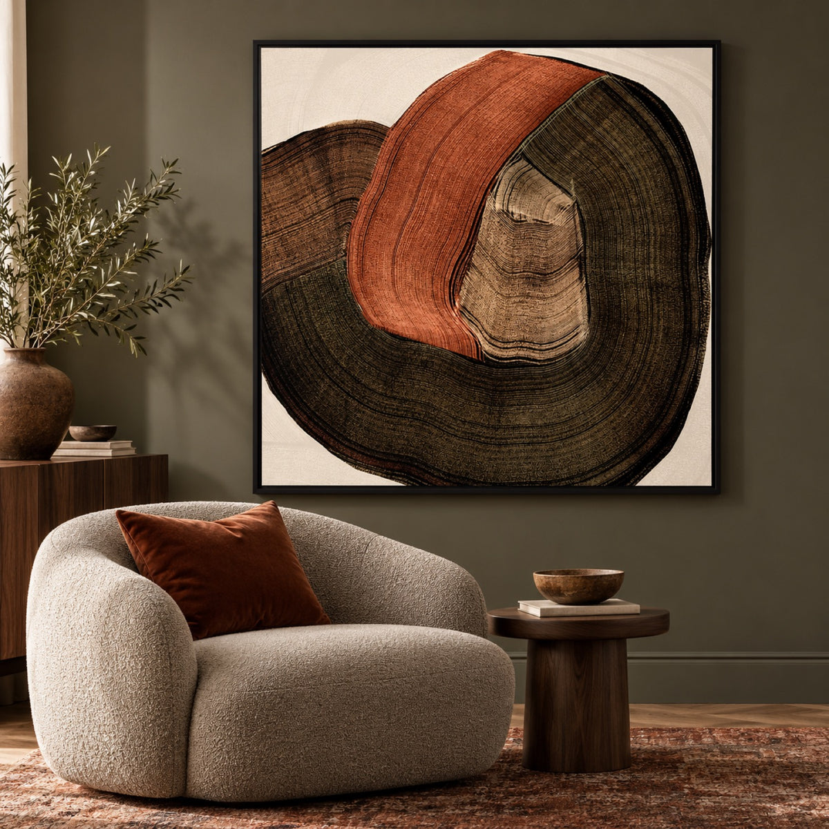 Folded Earth Style B in a black frame in a contemporary reading corner with walnut furniture and a rust cushion.