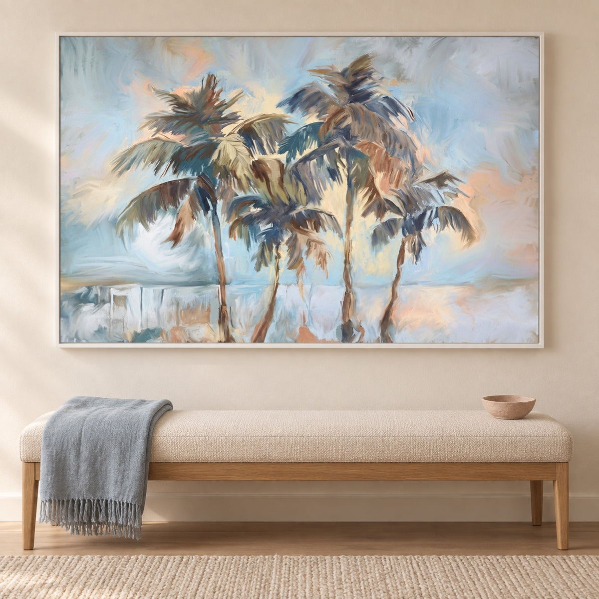 Swaying Palms Landscape in a slim white frame above a cream and oak bench with a blue-grey throw.