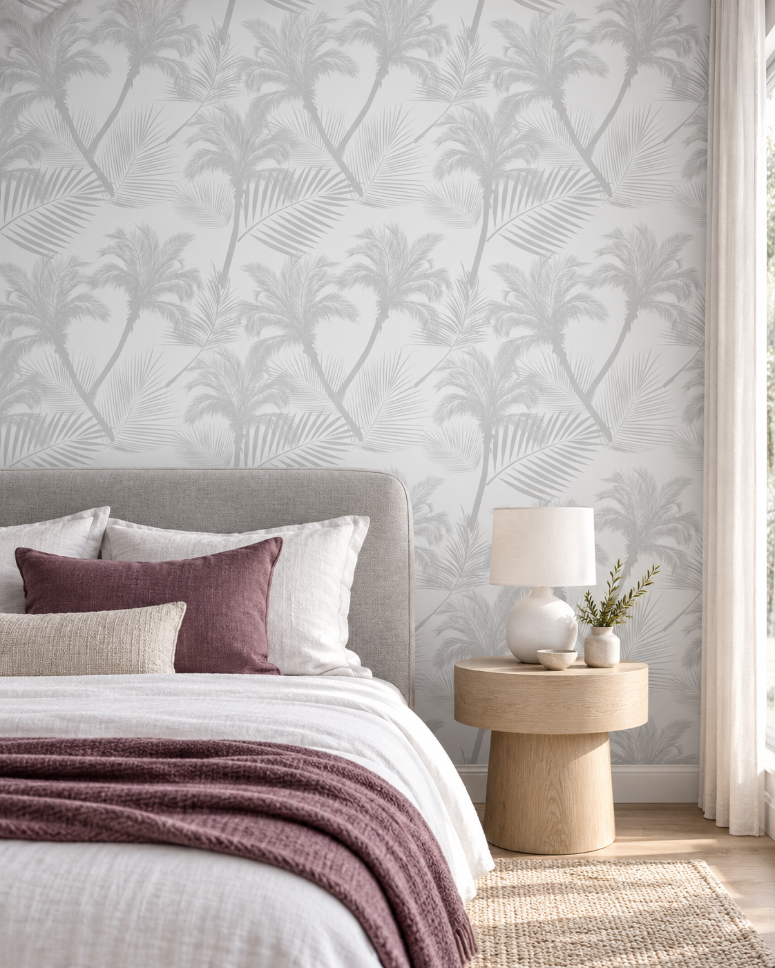 Grey Palm Trees Wallpaper in a contemporary bedroom with light grey upholstery, plum linen and oak bedside furniture