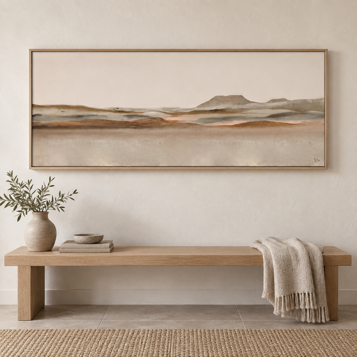 Home landscape wall art styled above a simple pale oak bench
