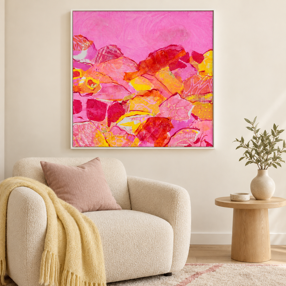 Icecream drive by Lindy Farley in a white frame above a cream chair with blush and pale yellow textiles.
