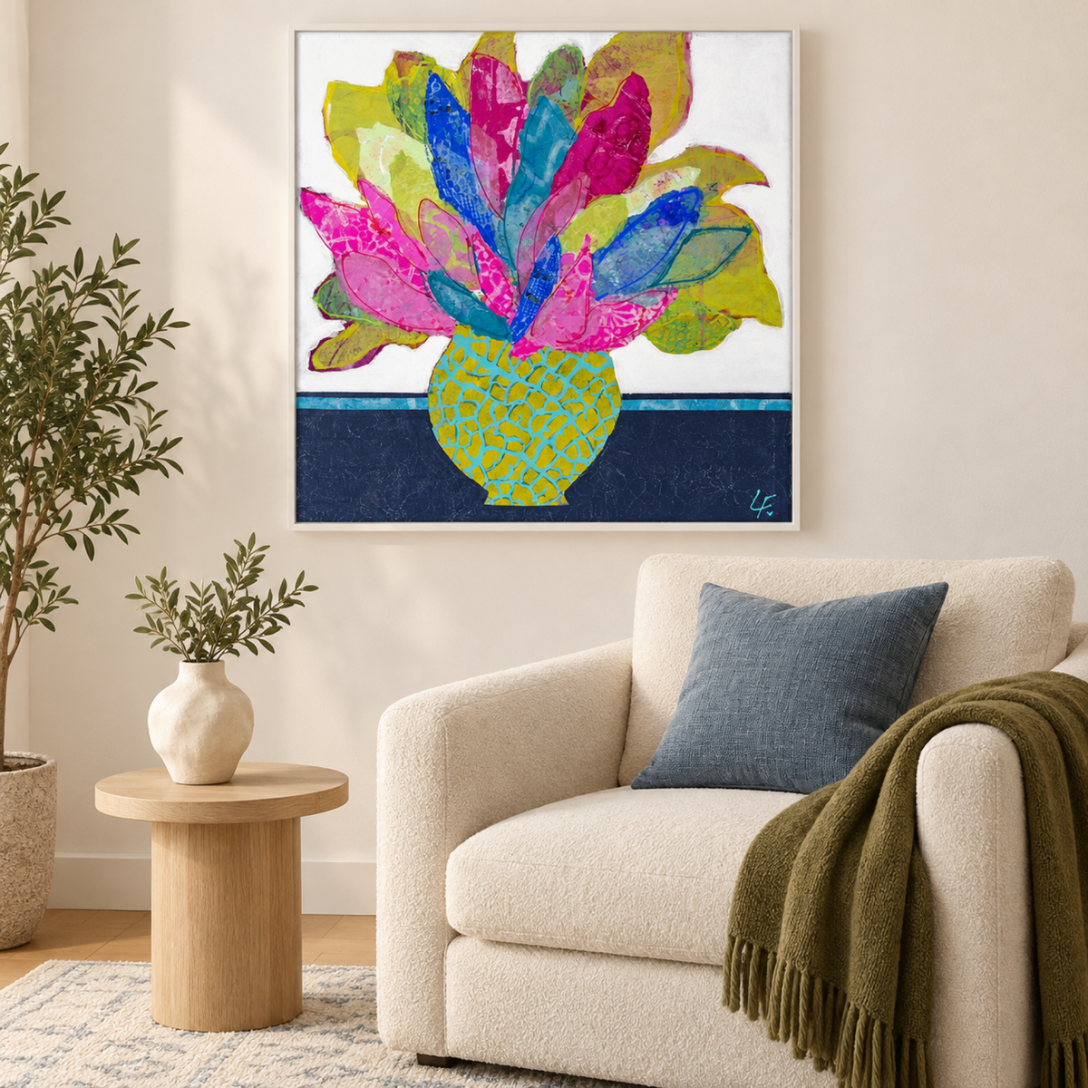 Lavinia by Lindy Farley in a white frame above a cream chair with blue and olive textiles.