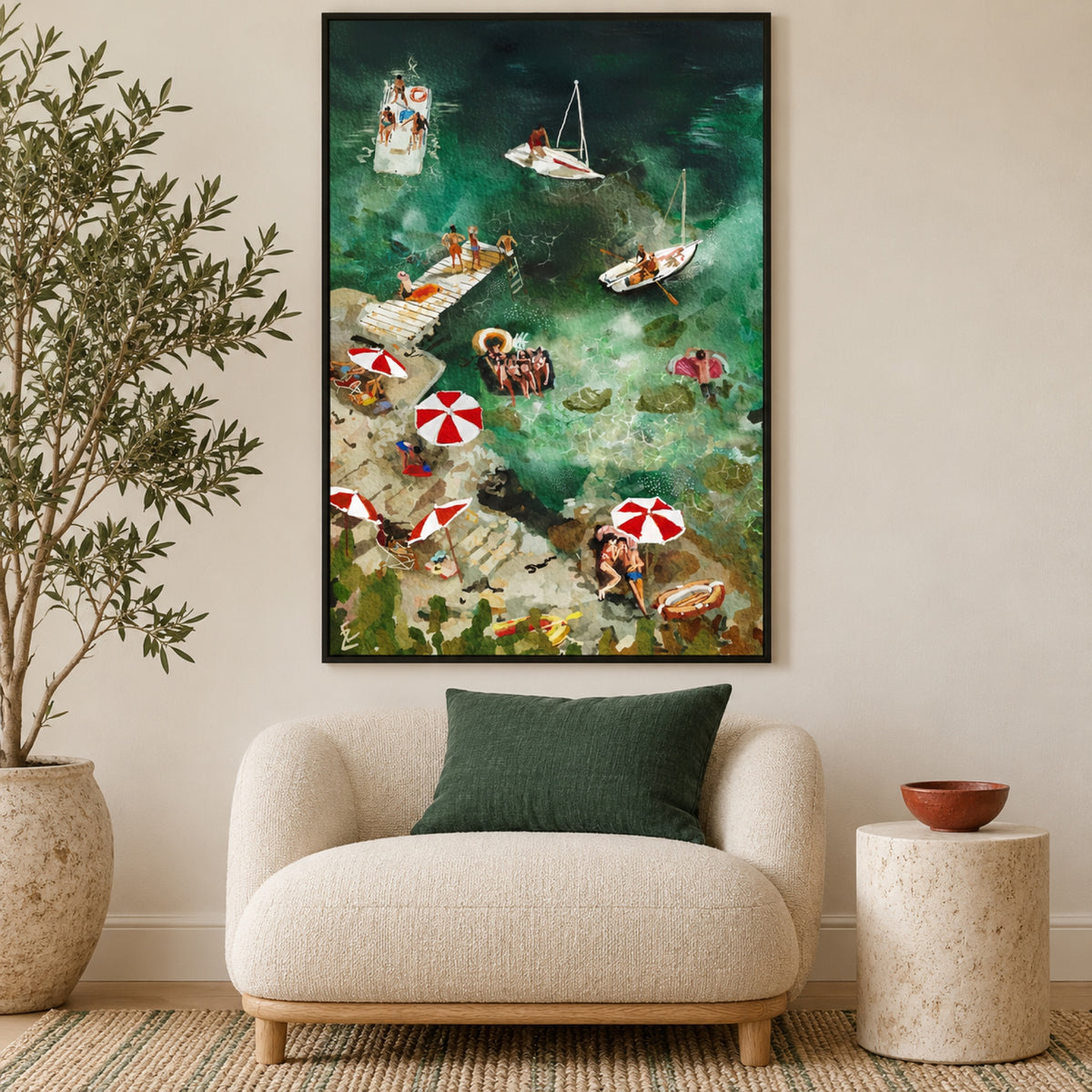 Lovers on the beach by Ekaterina Zagorska in a slim black frame above a cream lounge chair with an emerald cushion and stone side table.