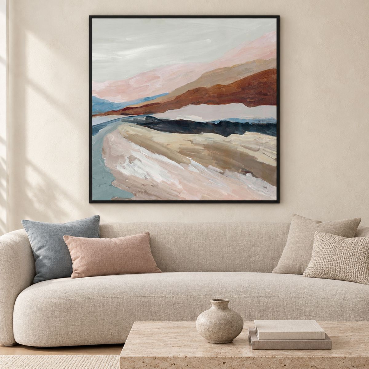Shadows of Dusk by Jacob Q in a black floating frame above a curved neutral sofa in a contemporary living room.
